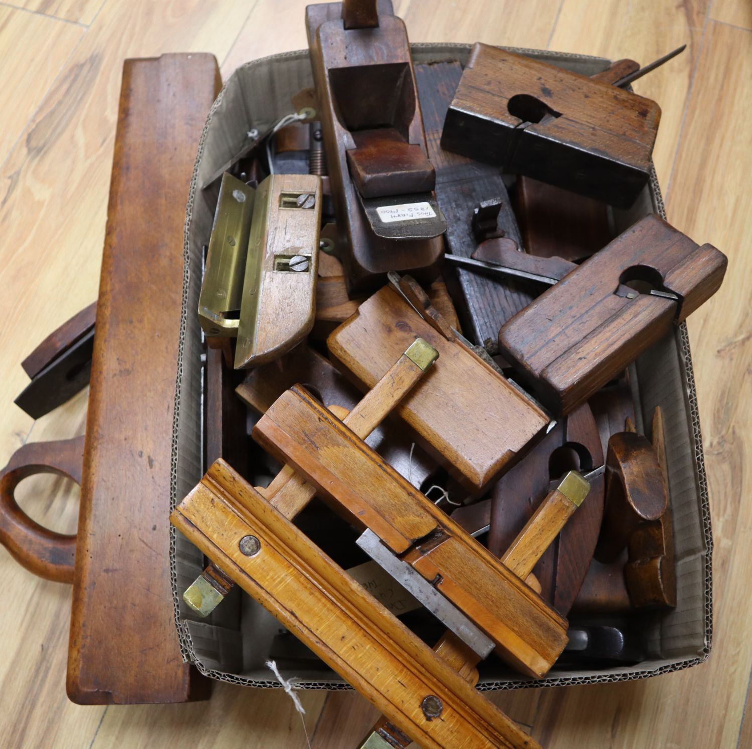 A box of woodwork planes comprising of three plough planes, one Coopers / Wheelwrights, one threshold drip plane, a pair of tongue